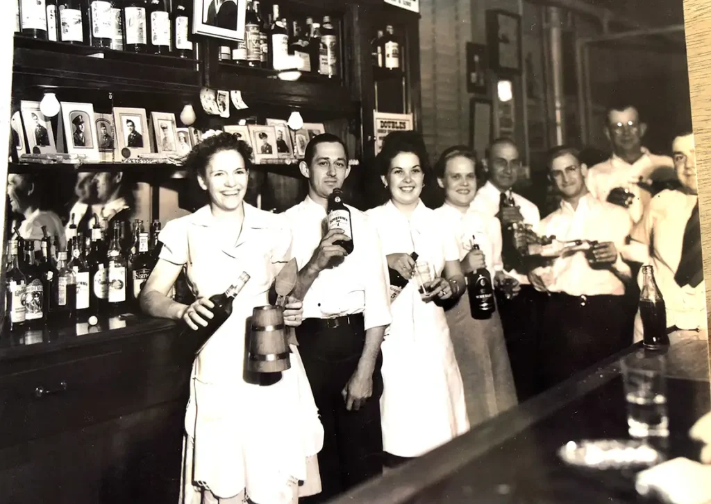 “Ethel and Jim Hirsch Welcoming Returning Soldiers after World War II in a Highland Bar,” Highland, IL